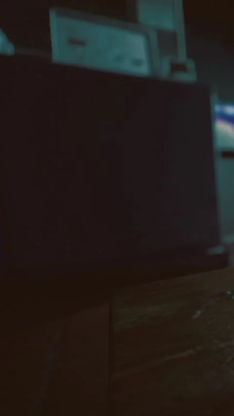 Tech equipment set up in an office space during night hours for work tasks Stock Footage 332213257