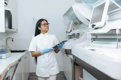 Tech examining data in lab Stock Photos