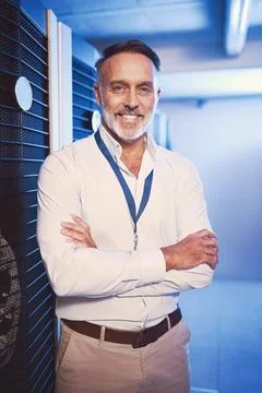 The tech guru is here to save the day. Portrait of a mature man working in a Foto stock