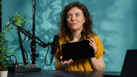 Tech guru presenting tablet from brand sponsoring video Stock Photos