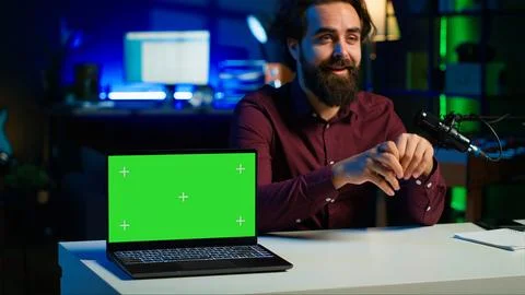 Tech guru in studio films tutorial on how to do maintenance on chroma key laptop Stock Photos