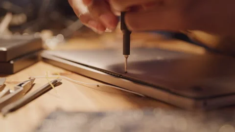 Tech Guy Unscrewing Electronic Stock Footage 208777953