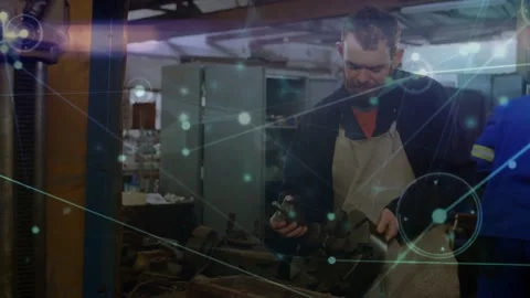 Tech inspecting securing part on vise in shop, network overlay mapping alignment Stock Footage 331821067