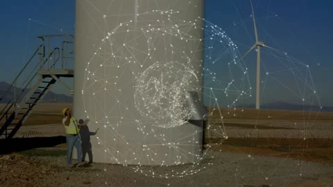 Tech inspecting wind turbine base using phone, tablet activating holo sphere 動画素材 329899100