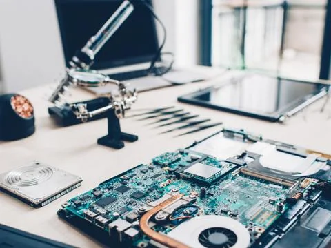 Tech laboratory engineer workplace laptop parts Stock Photos