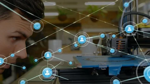 Tech leaning into 3D printer as blue nodes emerging above bed growing network, Stock Footage 334312872