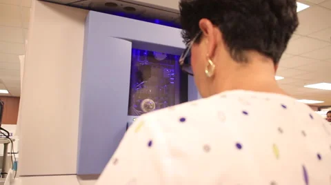 Tech at machine Video stock 53878376