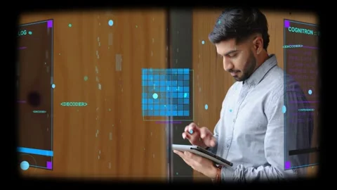 Tech man tapping tablet by window, animating AR grid and markers, glancing then Stock Footage 333509841