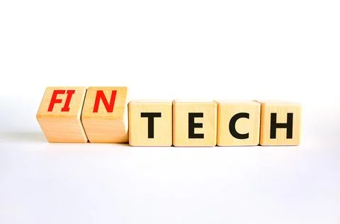 Tech or fintech symbol. Concept word Tech and Fintech on wooden cubes. Beau.. Stock Photos