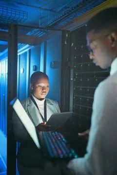 Tech, people and inspection in server room for database, system performance or Stock Photos