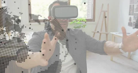 Tech pro donning VR headset in office raising hands rotating globe and expanding Stock Footage 318070357