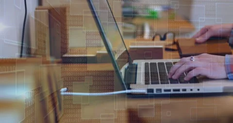 Tech pro placing hands, typing on laptop, reaching box, binary overlay blending Stock Footage 331125507