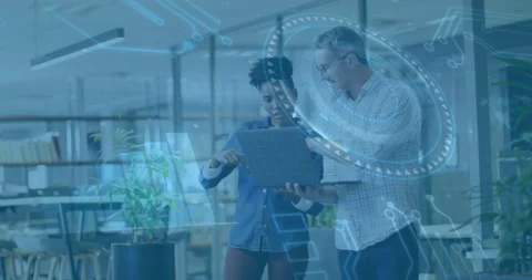 Tech pro swiping tablet launching hologram for data analysis while colleague Stock Footage 314148453
