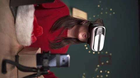 Tech product review using smartphone on tripod. Female vlogger unboxing parcel Stock Footage 255648886