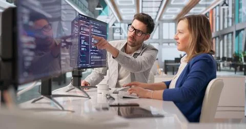 Tech Professional Collaborates On Programming To Create Innovative Solutions 写真素材