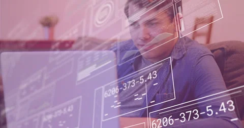 Tech professional settling on sofa, typing on laptop, creating data panels Stock Footage 311049240