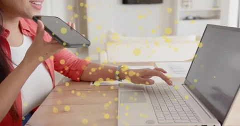Tech professional starting data entry on laptop then moving into smartphone call Stock Footage 315716645