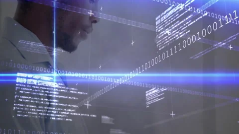 Tech professional tapping tablet and scrolling binary code, analyzing data with Stock Footage 310438189