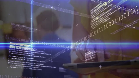 Tech professional tapping tablet and revealing animated binary code forming Stock Footage 311039718