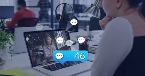 Tech professional watching webinar at desk reacting to chat bubble showing Stock Footage 319571585