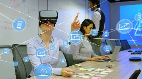 Tech professionals collaborating in office, woman wearing VR headset interacting Stock Footage 308658555