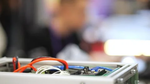 Tech project with visible wires and circuitry in metal enclosure Stock Footage 345022628
