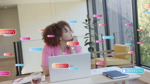 Tech remote worker woman typing at laptop, incoming UI badges piling, pausing Stock Footage 336714369