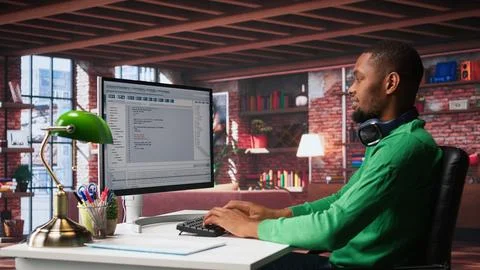 Tech savvy black engineer developing secure online program at home 스톡 사진