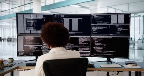 Tech-Savvy Engineer Debugging Software Code Stock Photos
