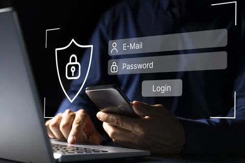 Tech-savvy young man typing on laptop for secure login into social media account Stock Photos