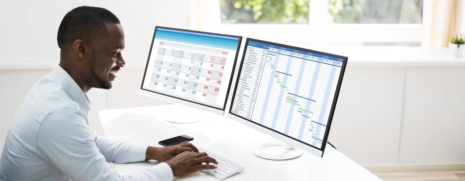Tech Schedule List On Computer Screen Stock Photos
