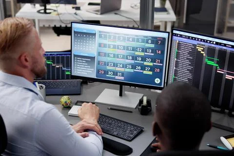 Tech Schedule List On Computer Screen Stock Photos