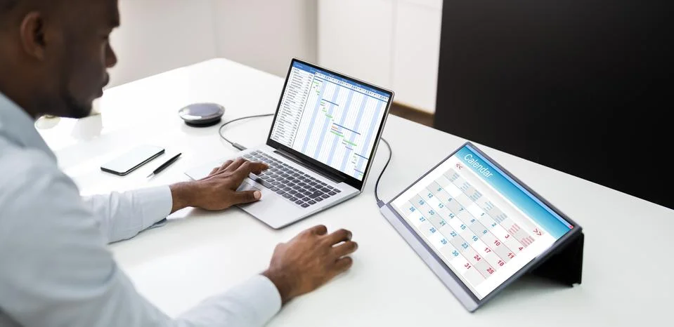 Tech Schedule List On Laptop Computer Screen Stock Photos