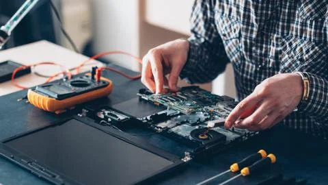 Tech service computer diagnostics engineer laptop Stock Photos