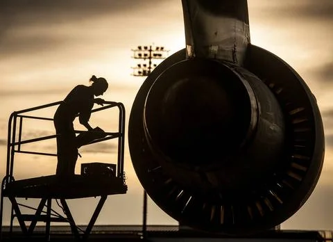 Tech. Sgt. Laura Moseley performs an engine check on a C-5 Galaxy after la... Stock Photos