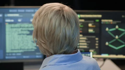 Tech Specialist Analyzing Codes on Computers in Network Security Office Stock Footage 334931245