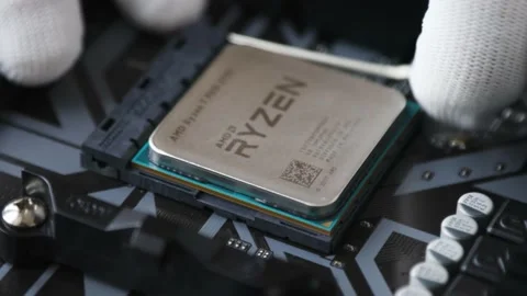 A tech specialist engineer removing the CPU from socket on the motherboard Stock Footage 195154533