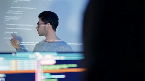 Tech Specialist Explaining Code at a Team Meeting. Stock Footage 273192670