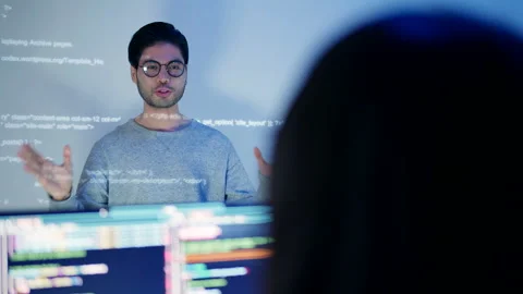 Tech Specialist Leading a Nighttime Coding Presentation. Video stock 300246869