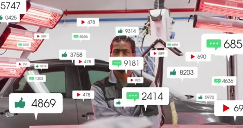 Tech standing in autoshop red lamps bubble pops icons rising tracking likes Stock Footage 331125968