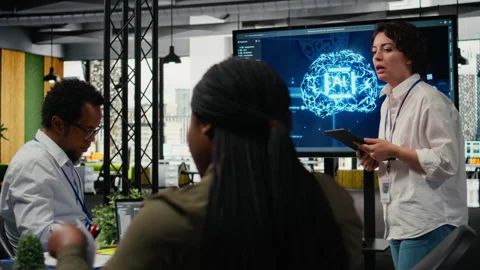 Tech startup office CTO doing presentation on machine learning to investors Stock Footage 323144695