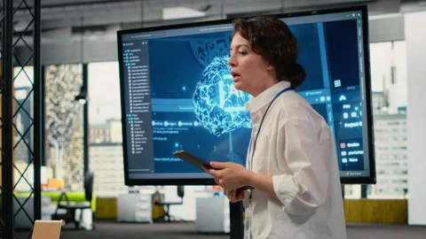 Tech startup office CTO doing presentation on machine learning to investors Stock Footage 323238544