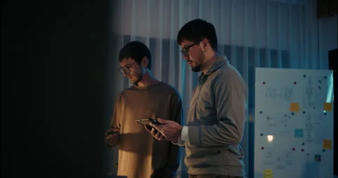 Tech Startup Team Analyzing Data on Tablet and Smartphone. Stock Footage 306739171