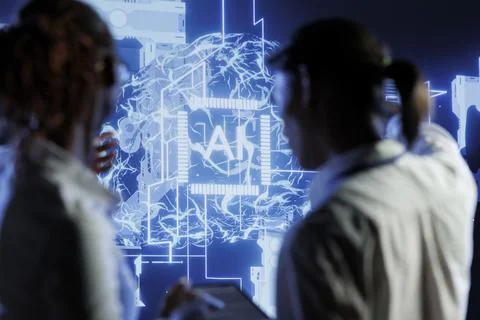 Tech support brainstorms ways to use AI Stock Photos