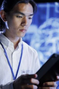 Tech support does AI systems checkup Stock Photos