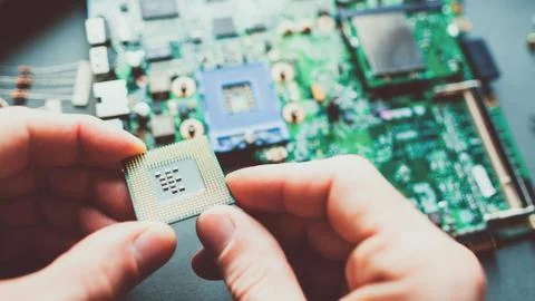 Tech support engineer installing cpu motherboard 写真素材