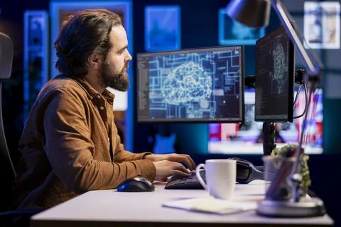 Tech support expert typing on keyboard, doing checkup on AI systems Foto stock