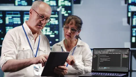 Tech support running code in data center Stock Footage 249775270