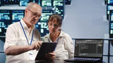Tech support running code in data center Stock Photos