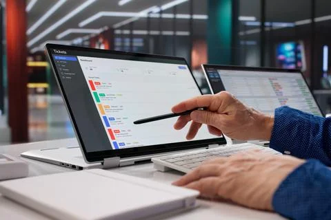 Tech Support Specialist Upgrading Software And Monitoring Ticket System Remot Stock Photos